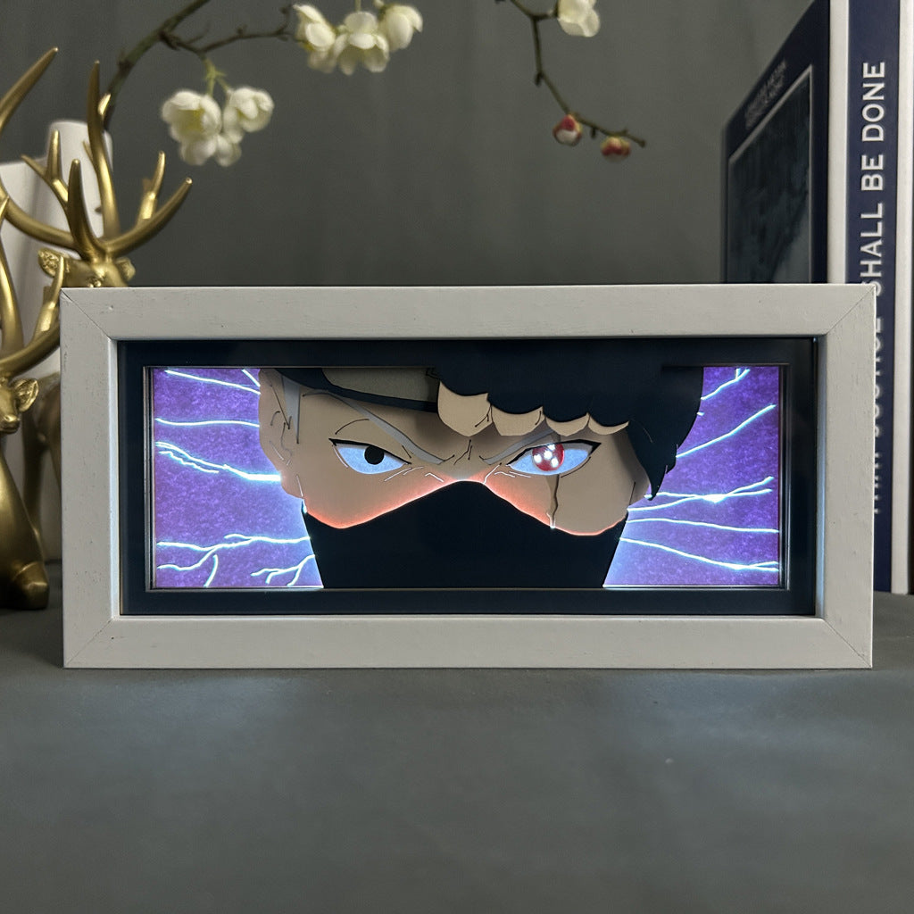 The Naruto Anime Light Box features Kakashi Hatake with his iconic red and black eyes and black mask against a lightning-filled purple backdrop. This framed 3D art offers 16-color adjustable LED lighting, complemented by decorative objects and a book, creating a stunning scene.