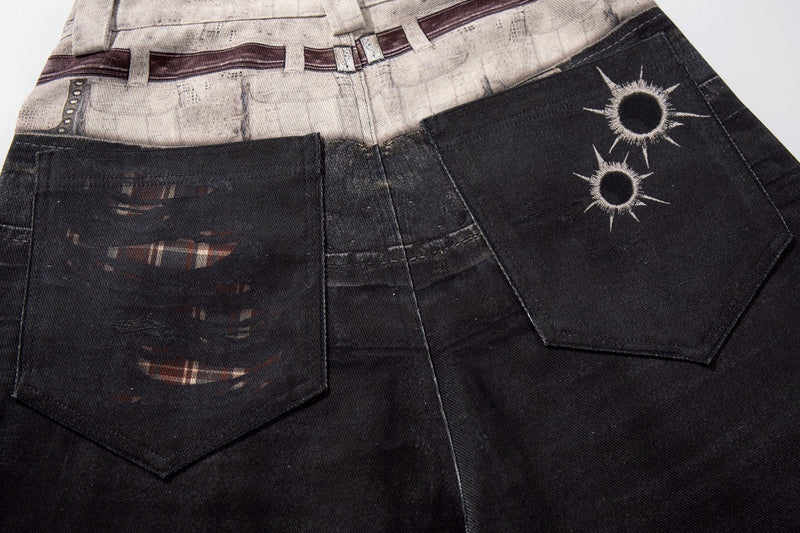 Back view close-up of patch pockets on black wide-leg denim pants with plaid panel and printed tear marks