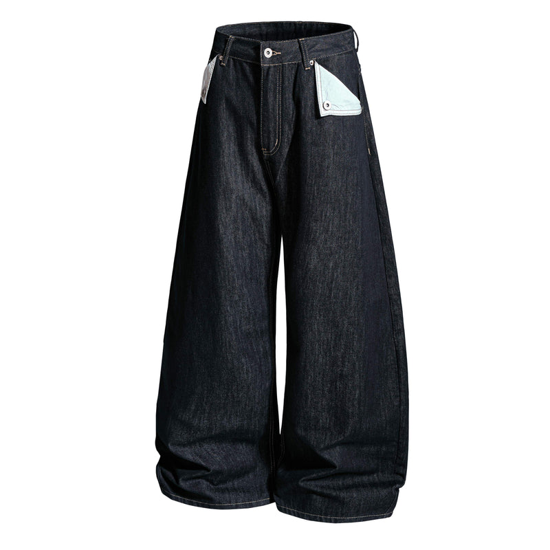 Front view of dark wash wide-leg denim pants with slightly angled waistband and contrast pocket flaps
