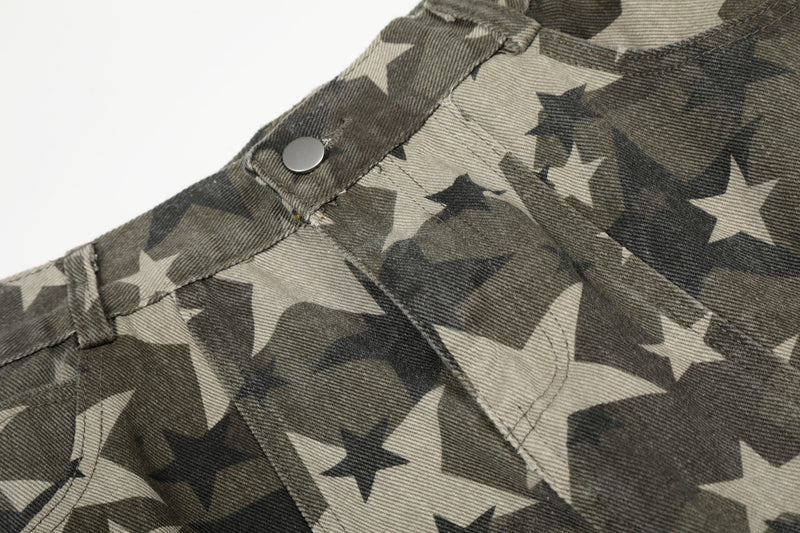 Close-up of waistband seam and snap button on star camo fabric