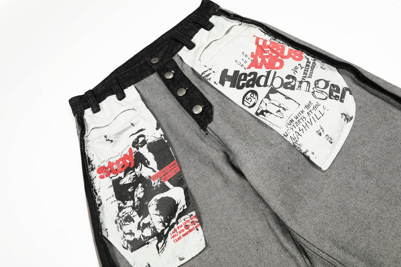 Close-up angled front of jeans showing graphic patch pockets, snap buttons, and contrast panel seams