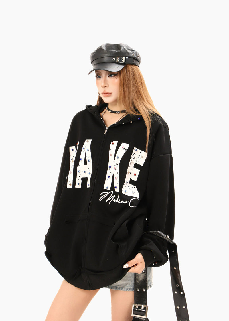 Black oversized zip hoodie worn by model, angled front view with MAKE print