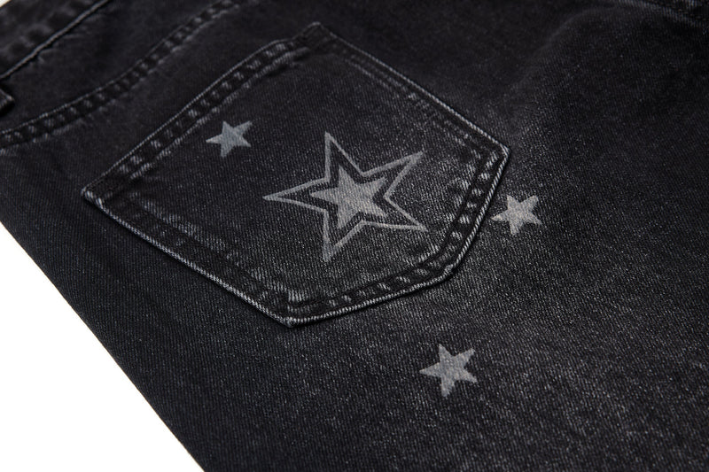 Close-up of back pocket on black star-washed jeans