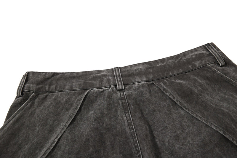 Dark charcoal denim back waist close-up with belt loops and side seam