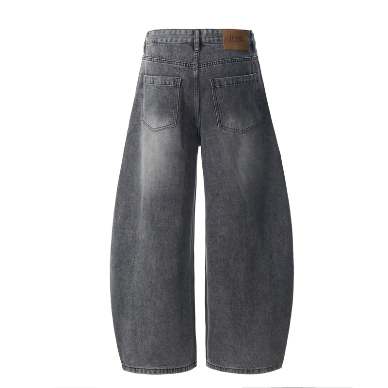 Back view of vintage grey barrel-leg denim jeans with patch pockets and leather label