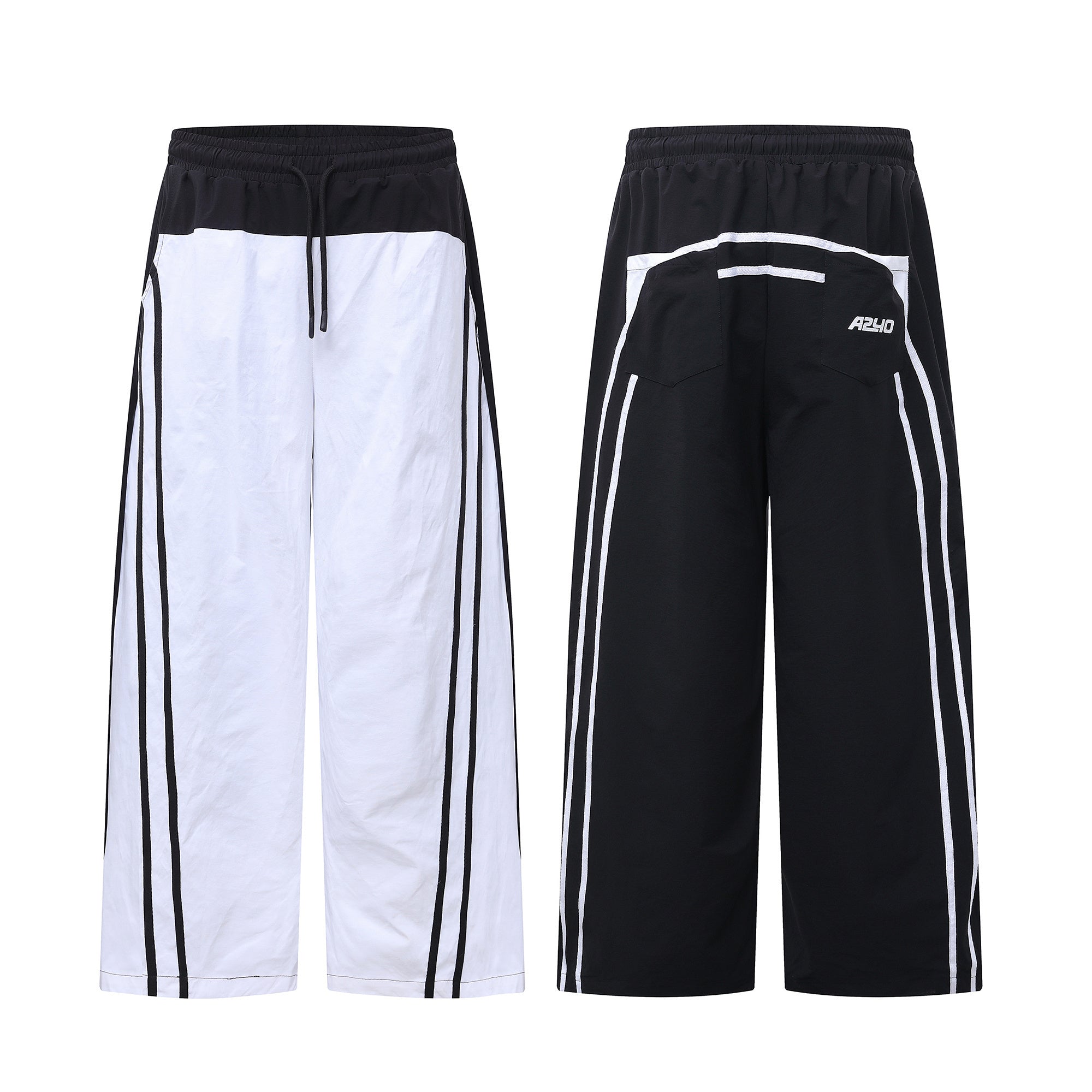Front and back view of black and white contrast color-block wide-leg track pants with dual side stripes and drawstring waist