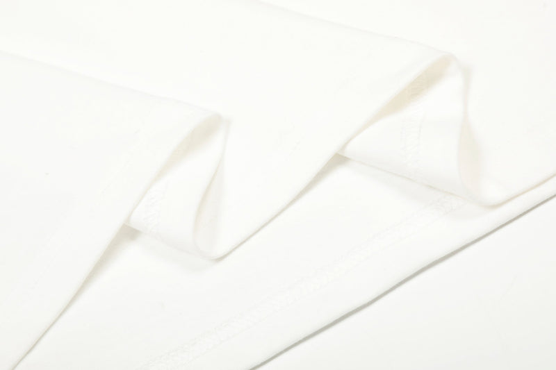 Close-up of white sleeve fabric draped in soft folds