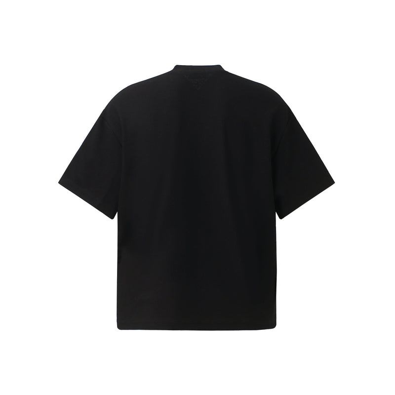 Black waffle knit tee shown from the back, featuring a relaxed oversized fit and short sleeves on a clean white background