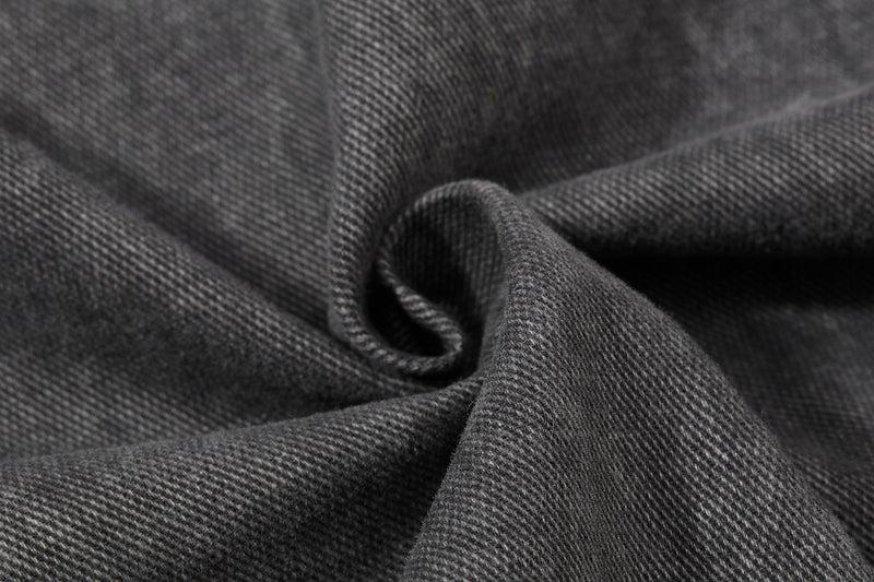 Close-up of dark gray denim-like fabric texture