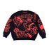 A Premium Jujutsu Kaisen-inspired black knit sweater featuring red jacquard designs of Yuji Itadori and Nobara Kugisaki, with bold anime-style graphics and Japanese text on the front and sleeves by Jujutsu Kaisen.