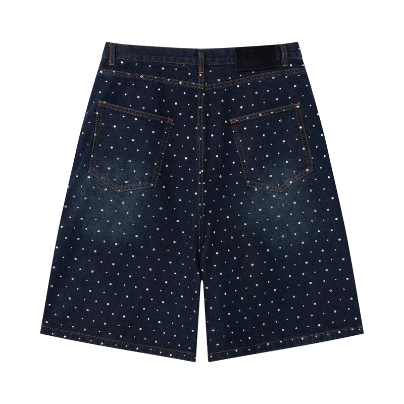 Back of black denim shorts with pearl studs and patch pockets
