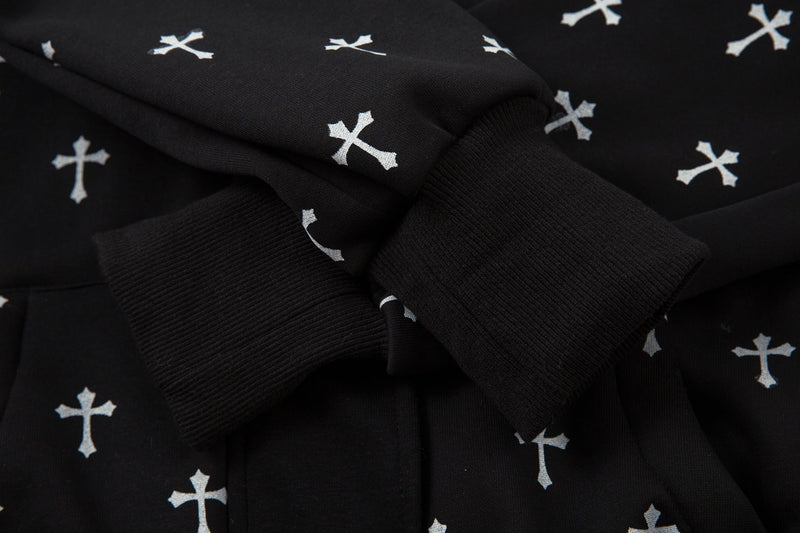 Close-up of black bomber jacket sleeve cuff with cross print