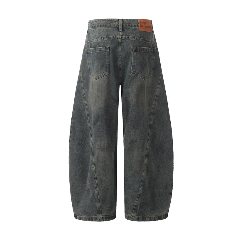 Back view of dark washed wide leg jeans with patch pockets and brown waistband label