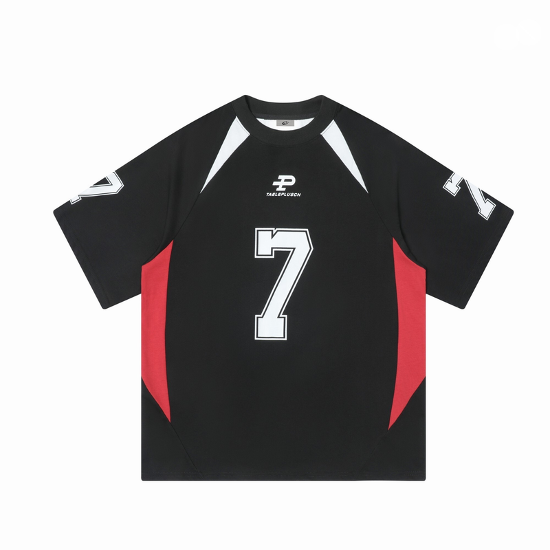 Black varsity jersey tee with white number 7 print and red side panels, laid flat on a white background