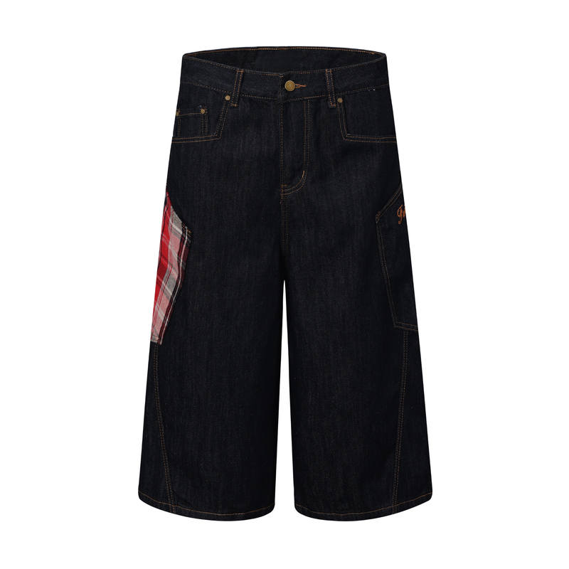 Front view of dark indigo denim jorts with red plaid side patch and wide-leg cut