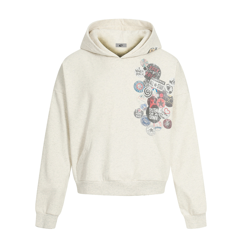 Cream hoodie front view with retro badge collage graphic on the left chest