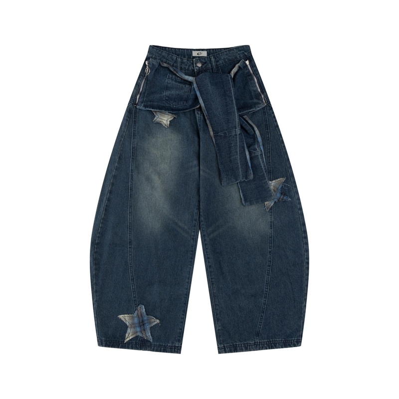 Front view of dark blue wide-leg jeans with star patches, asymmetrical wrap detail, and zip pockets