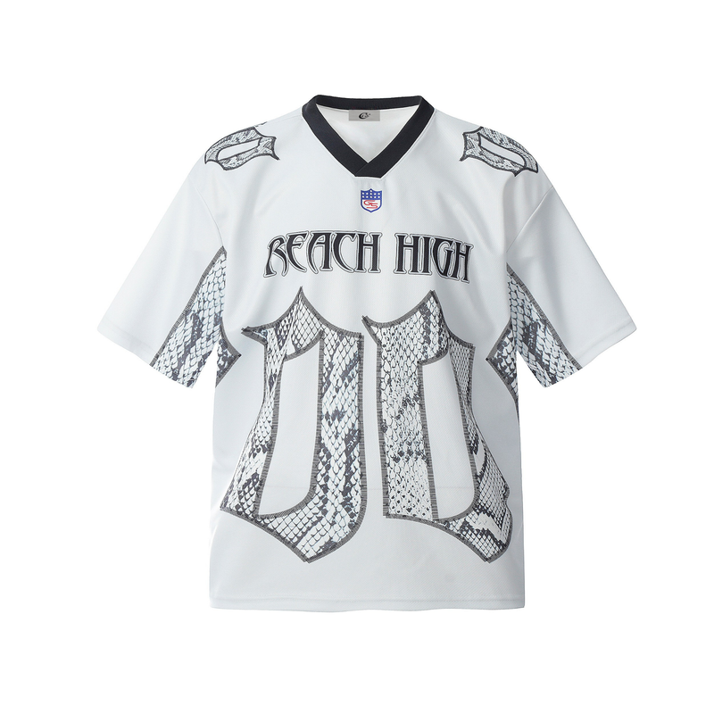 White jersey tee with black V-neck collar, snakeskin graphics, and bold Reach High Gothic lettering