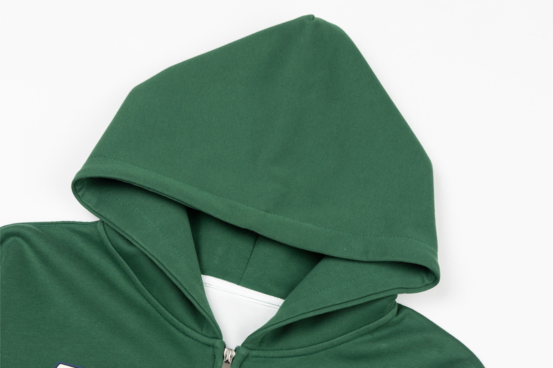 Close-up of green hoodie hood and upper zipper opening
