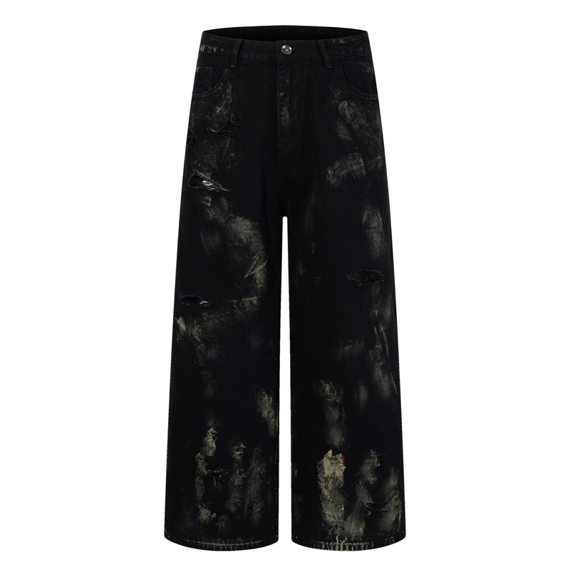 Front view of black wide-leg jeans with paint-wash distressing and ripped details