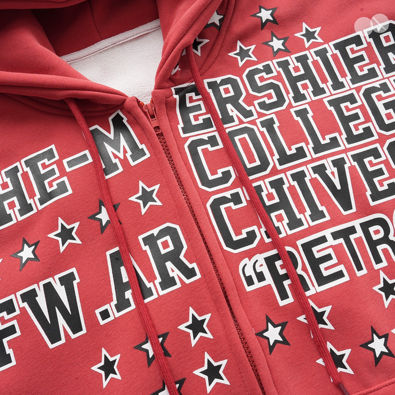 Front close-up of red zip hoodie with star print, drawstrings, and white fleece lining