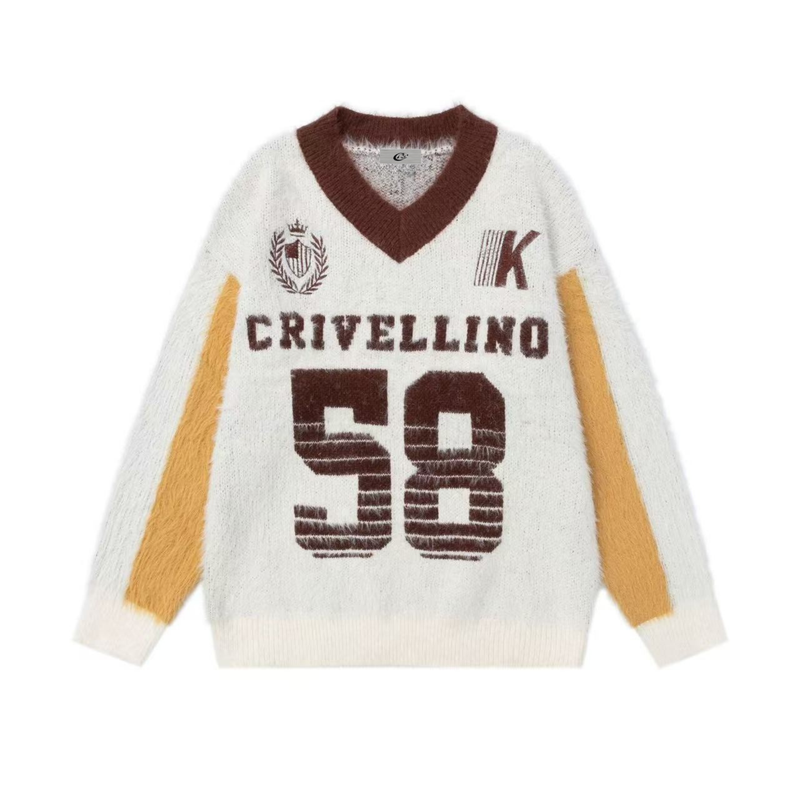 White fuzzy knit varsity sweater with brown V-neck, brown lettering, and yellow sleeve panels