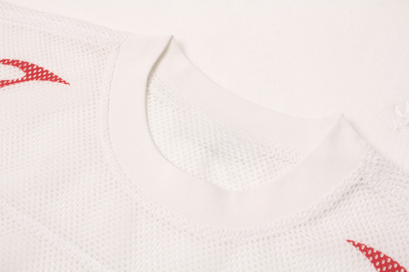 White oversized mesh jersey with red flame sigil accents and a ribbed crew neckline