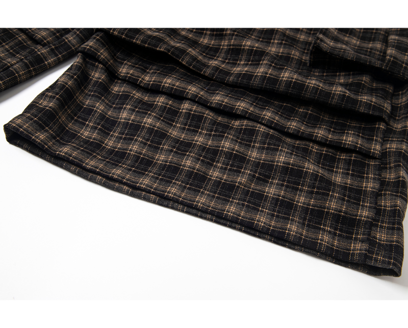 Close-up of plaid shorts hem with layered fabric and straight edge