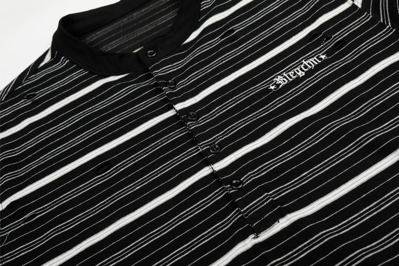 Close-up of black striped Henley tee showing buttons, distressed holes, and chest embroidery