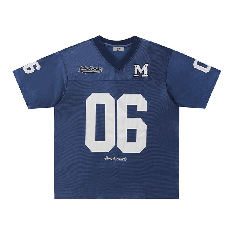Navy retro football jersey tee with white number 06, varsity M patch, and streetwear styling on a V-neck shirt