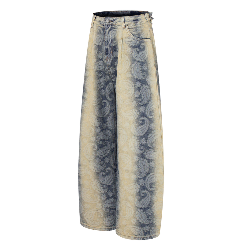 Front angled view of wide-leg jeans in faded paisley denim