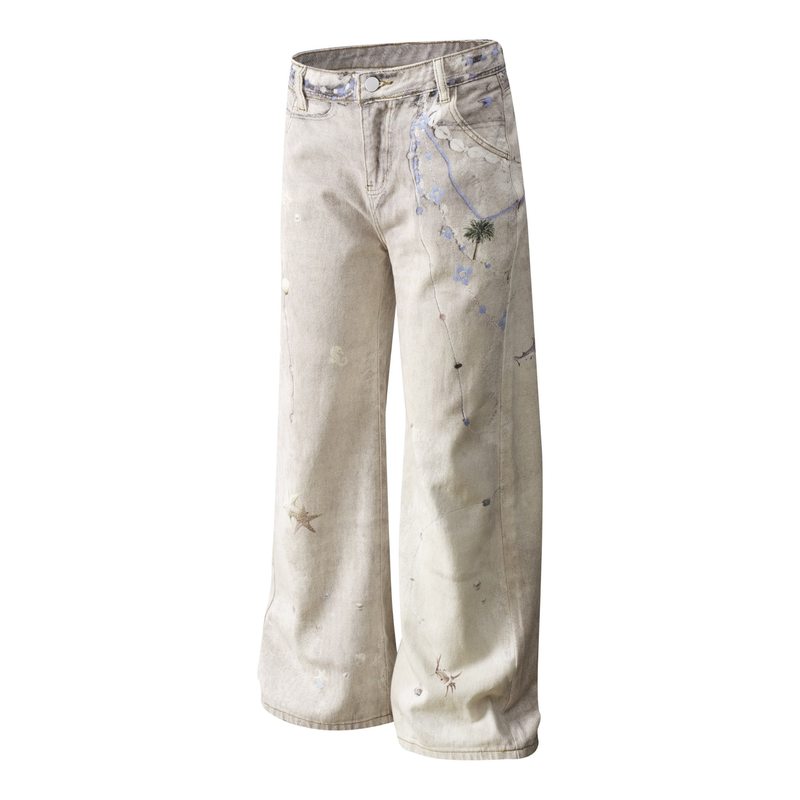 Front view of washed botanical print wide-leg jeans with palm and blue flower graphics