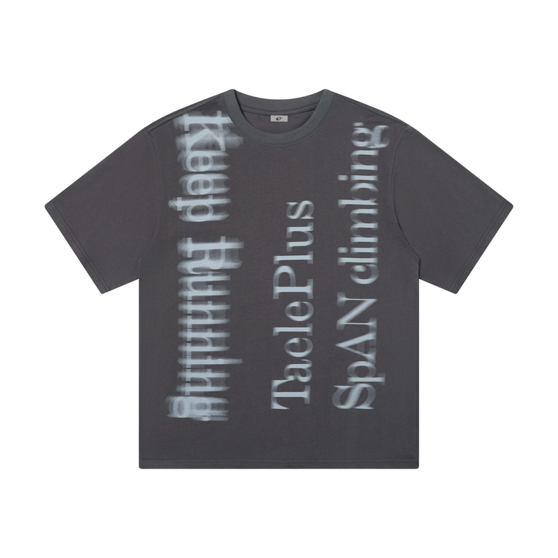 Oversized dark gray graphic tee with faded vertical spray-style lettering and relaxed streetwear fit