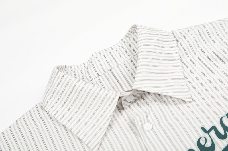 Close-up of shirt collar and front placket with fine vertical stripes