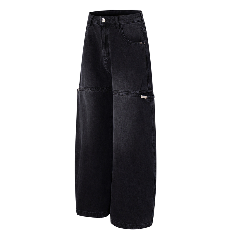 Dark wash split-panel wide-leg jeans angled front view with utility pockets and raw seam detail