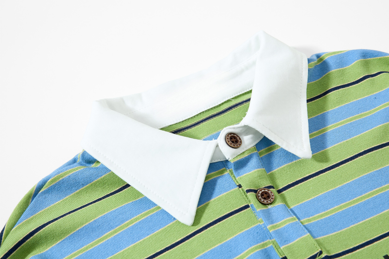 Close-up of white pointed collar and button placket on striped polo shirt