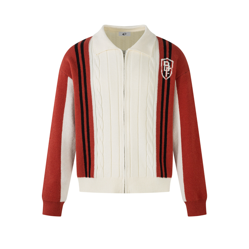 Front view of cream cable-knit zip jacket with red sleeves and black varsity stripes
