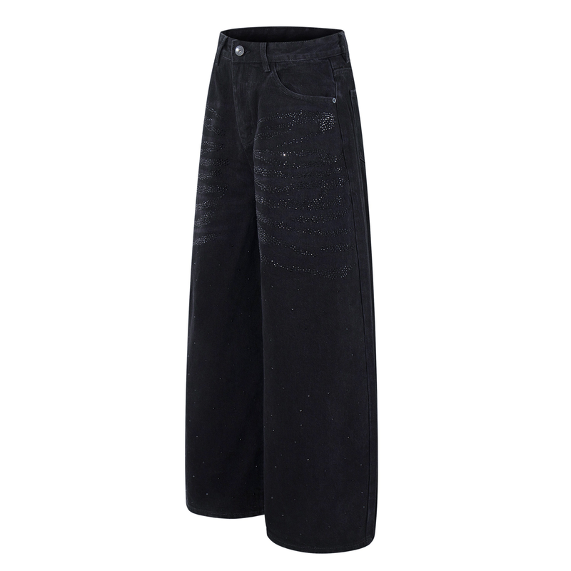 Side view of black wide-leg denim jeans with rhinestone swirl detailing along the leg