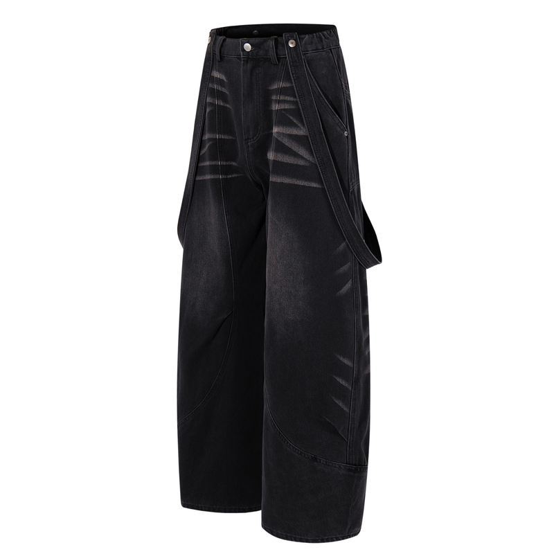 Three-quarter side view of dark denim wide-leg jeans with hanging strap details
