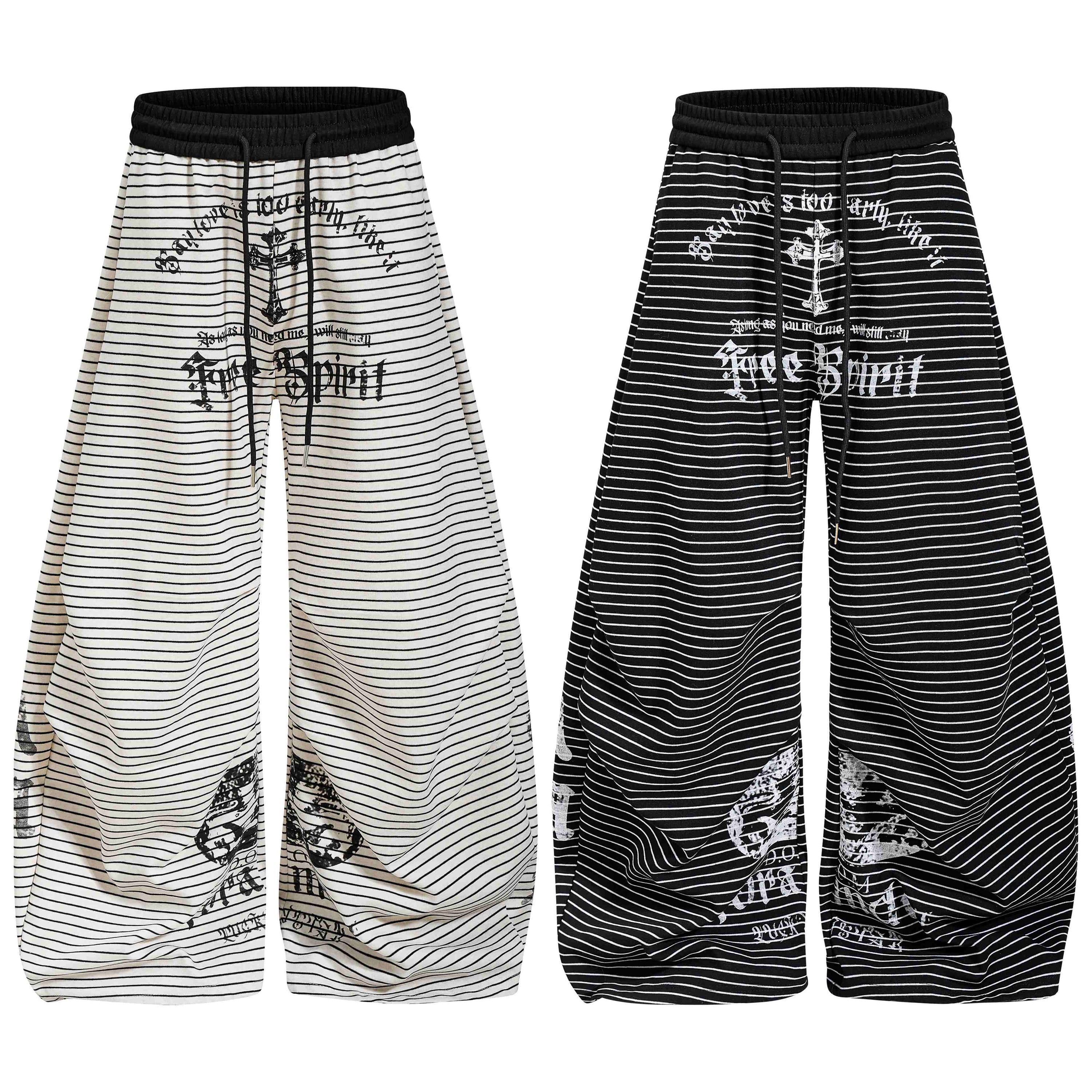 Cream and black striped wide-leg gothic draped pants with Free Spirit graphic print and elastic drawstring waistband