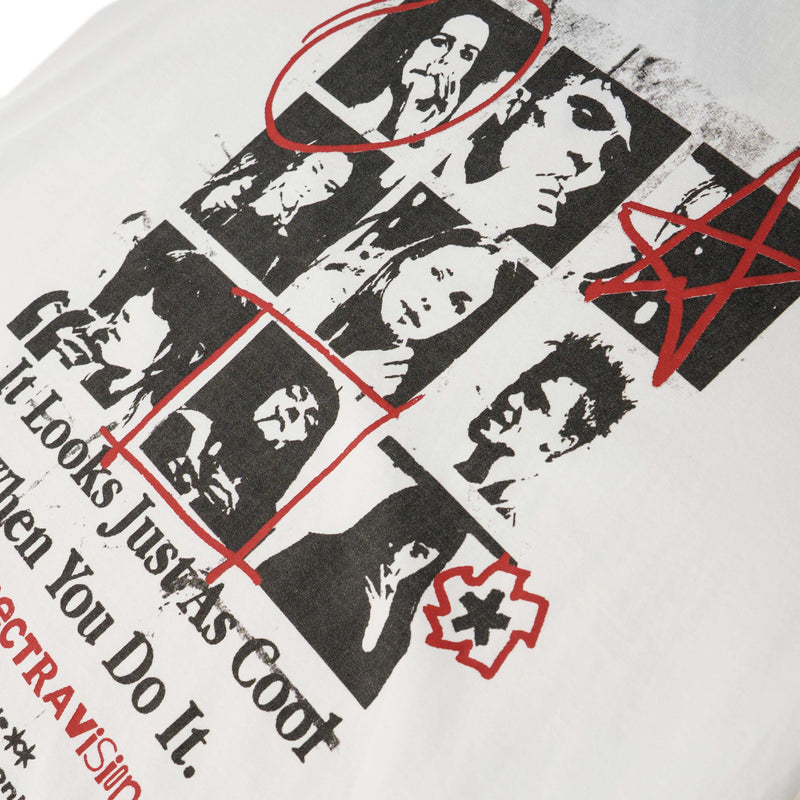 Vintage collage graphic tee with black-and-white face portraits and red scribble accents on white cotton fabric