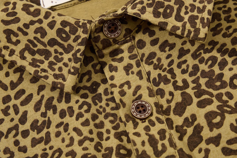 Close-up of a vintage leopard print polo tee with brown buttons and textured Y2K streetwear styling