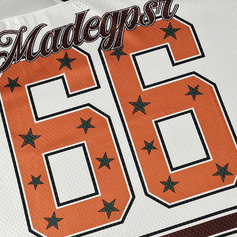 Seakoff Star varsity jersey with orange number 66 and green stars on white mesh fabric