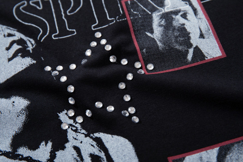 Black graphic T-shirt with vintage collage portraits and rhinestone peace symbol detail