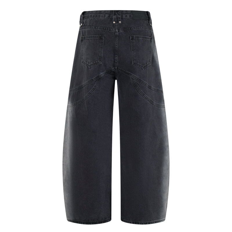 Back view of washed black wide-leg jeans with patch pockets and seam detailing