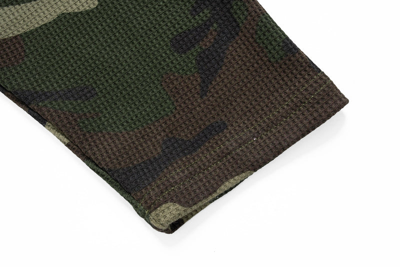 Close-up of camo sweatshirt sleeve cuff with waffle knit texture