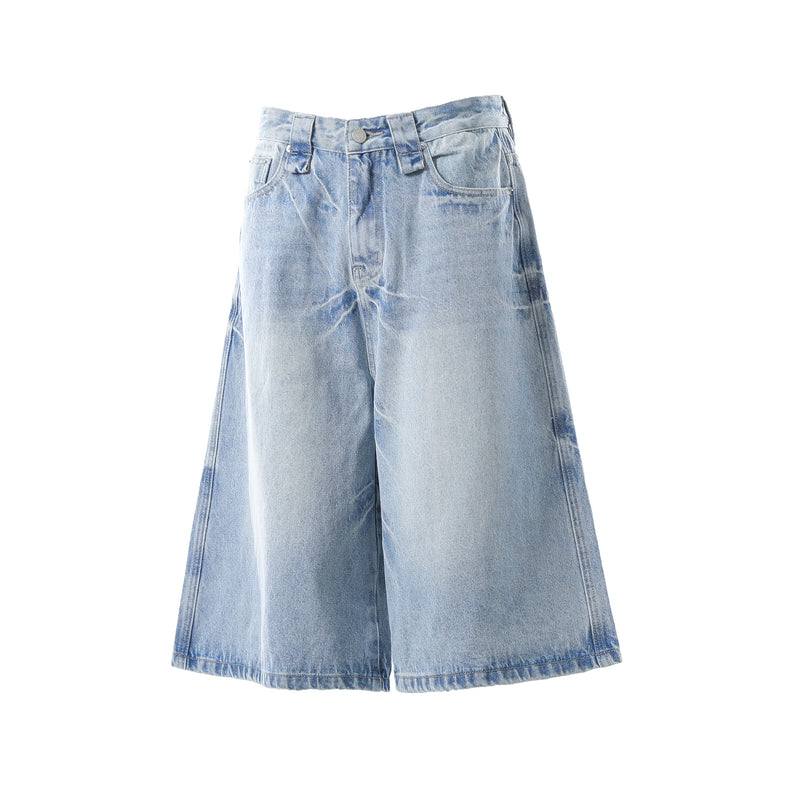 Light wash wide-leg denim shorts front view with faded whiskering and wide legs