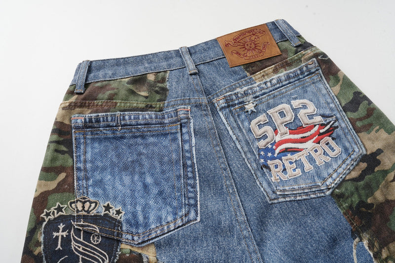 Back view close-up of denim jorts with camo panels, back pockets, and SP2 Retro patch