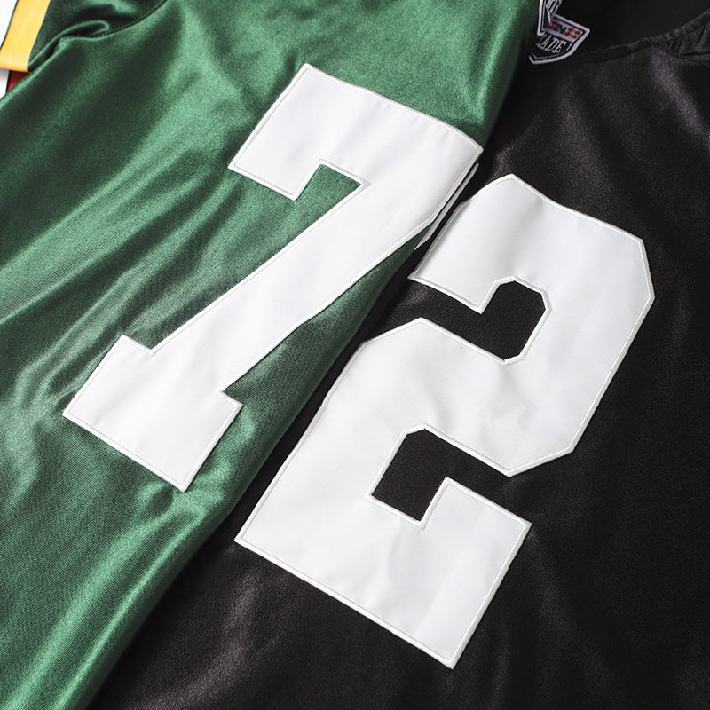 Close-up of green and black varsity football jerseys with oversized white number 72 and stitched athletic detailing