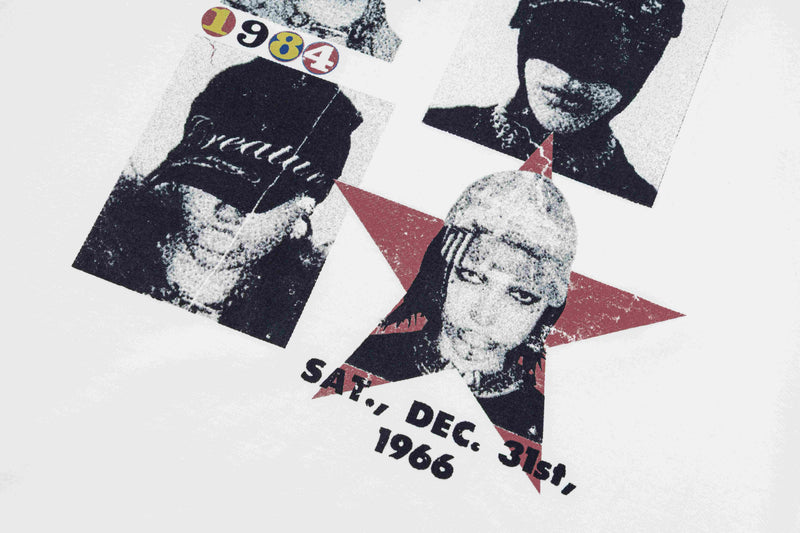 Retro graphic tee with distressed black-and-white portrait collage, red star accents, and 1984 text on white fabric